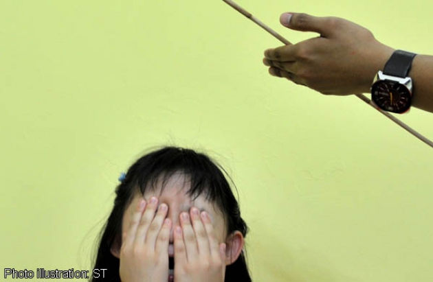 Little girl crying scared on cane. Image from Asia One Malaysia.