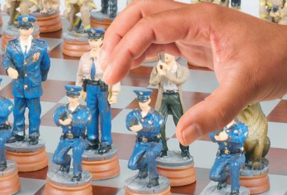 hand moving police chess set