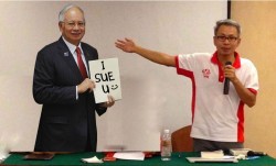 What does Najib gain from suing Tony Pua for his 1MDB comments?