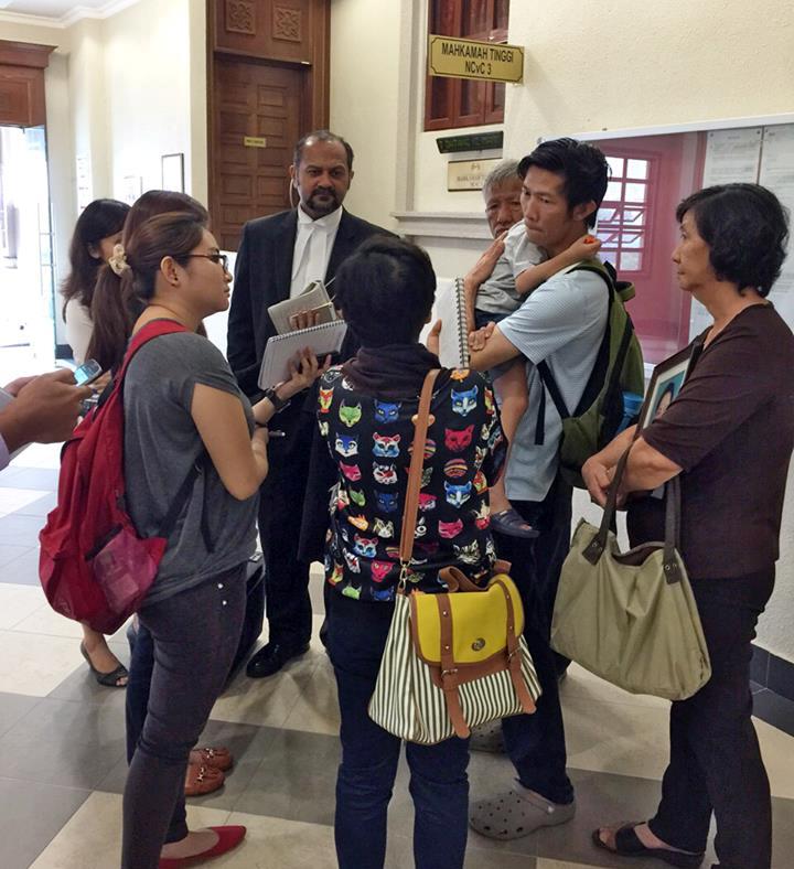 Gobind Singh Deo and Teoh's family surrounded probably by reporters. Image from DAP's Facebook