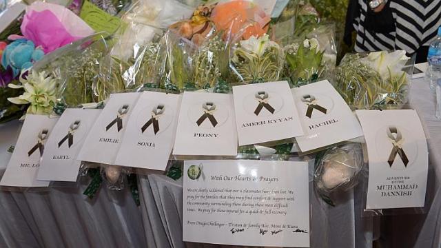 Flowers for the children who died. Photo from The Straits Times
