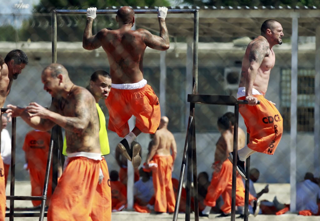 Inmates exercise at the California Institution for Men state prison in Chino, California, June 3, 2011. The Supreme Court has ordered California to release more than 30,000 inmates over the next two years or take other steps to ease overcrowding in its prisons to prevent "needless suffering and death." California's 33 adult prisons were designed to hold about 80,000 inmates and now have about 145,000. The U.S. has more than 2 million people in state and local prisons. It has long had the highest incarceration rate in the world. REUTERS/Lucy Nicholson (UNITED STATES - Tags: CRIME LAW POLITICS SOCIETY IMAGES OF THE DAY) - RTR2N9TY