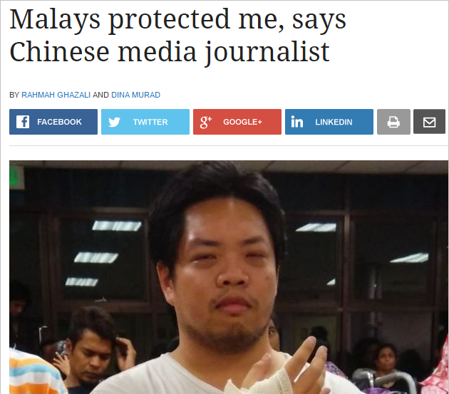 malays protected chinese journalist Screenshot from The Star