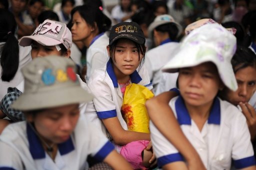 sad face myanmar foreign worker woman. Image from The Star