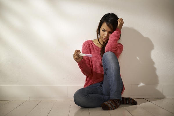 unwanted pregnancy test kit woman. Image from alldaychemist.com.