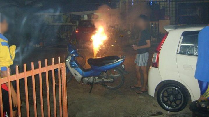 man guy playing firecracker house neighbourhood motorcycle. Image from photobucket