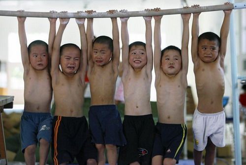 china children torture olympics training. Image from buzzin.net.