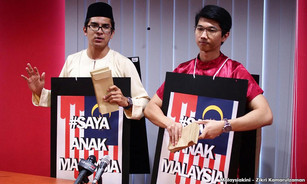 Bersatu Youth Chief and his Chinese friend will be touring May 13 haunts to distribute the message of unity - Image via MalaysiaKini