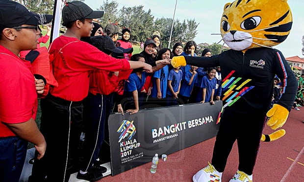 Khairy Jamaluddin is in the tiger costume. Source
