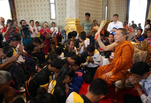 Thailand's Paralympic team being blessed by a monk before leaving the country