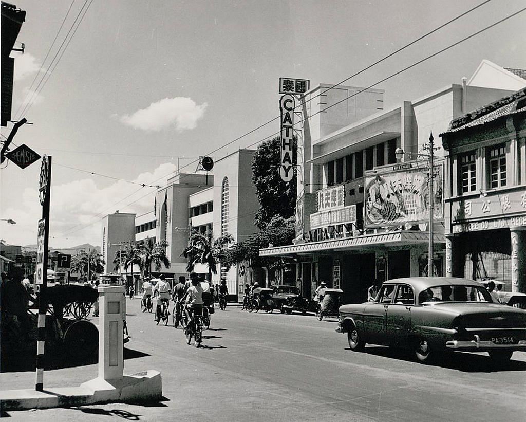 Cyclists in front of Cathay cinema on Penang Road circa 1964. Image from rsmurthi.com archived by web.archive.org
