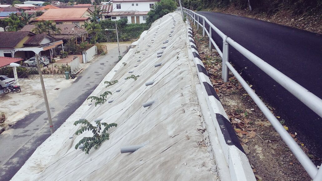 In case you're wondering what weep holes are, an example is those pipes jutting out of the concrete. It allows water to flow out of the slope's soil. Img from CCMalaysia's twitter.