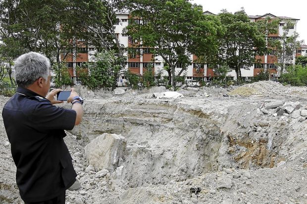 Illegal sand mining can happen very near people. This one was in PJ. Img from StarProperty.