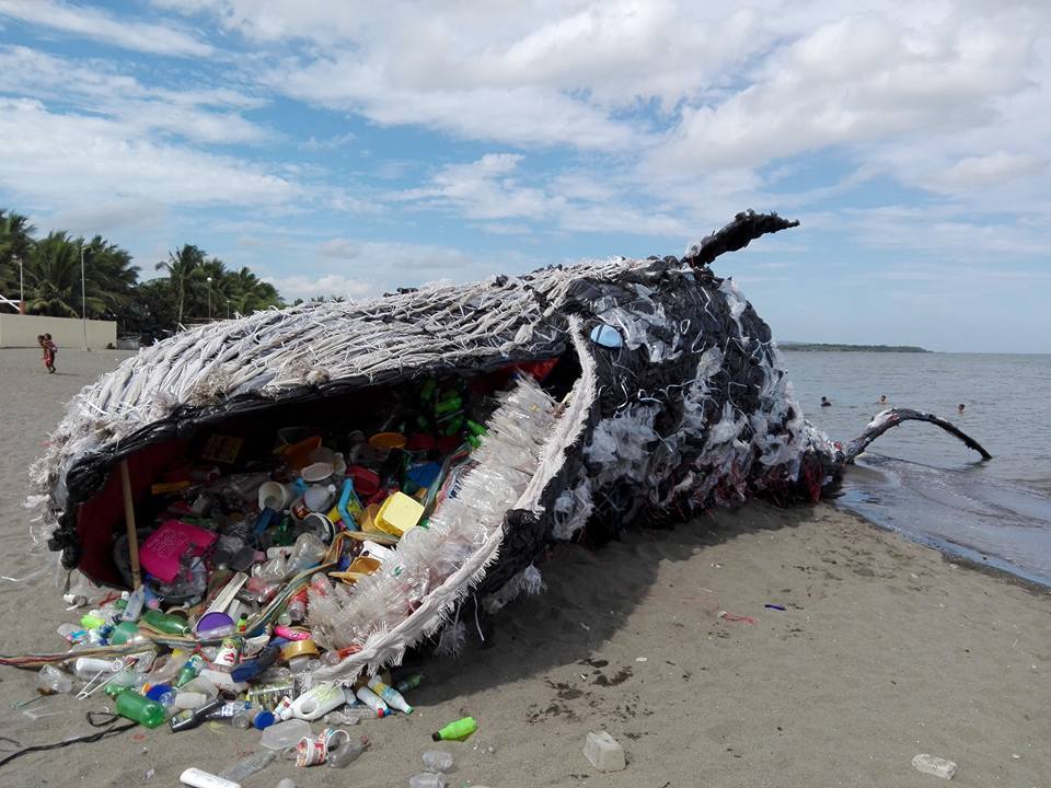 An installation depicting a beached whale, made by Greenpeace Philippines. Img from OneGreenPlanet.
