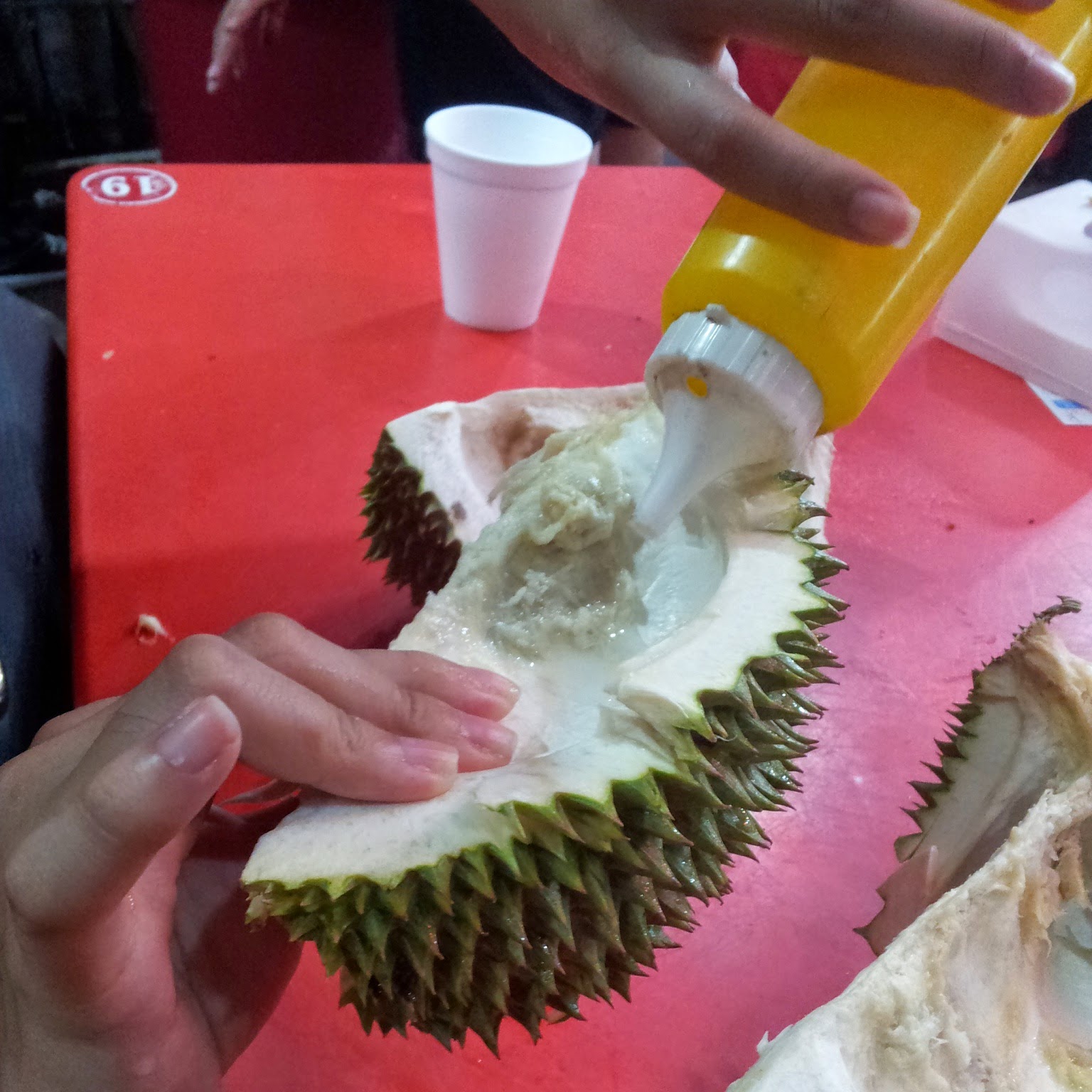 Some drink salt water in durian shells to cool themselves after eating durian. Img from michnoms' blogspot.