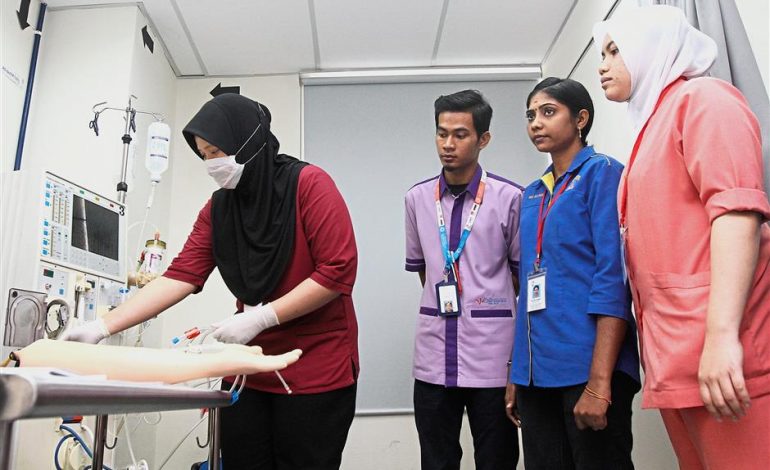 hospital staff learning dialysis needle tubes machine