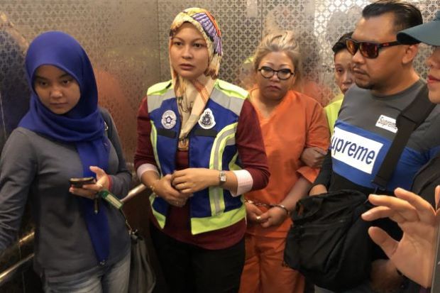 Siti Kasim (third from left) was arrested. Image from The Star