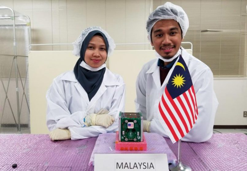 The students Syazana and Muhammad Hasif, with their cube satellite, UiTMSAT-1. Image from Amanz.my.