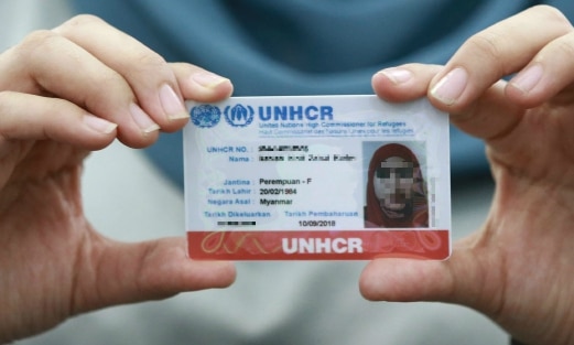 A UNHCR refugee card, which offers limited protection from the police. This is a fake one btw, obtained for RM120. Img from News Straits Times.