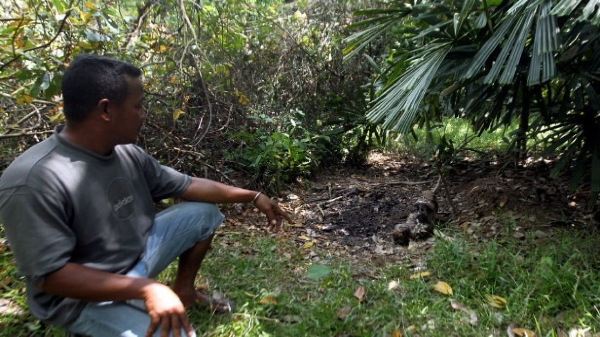 A villager showing where the body was found. Img from OneNews.