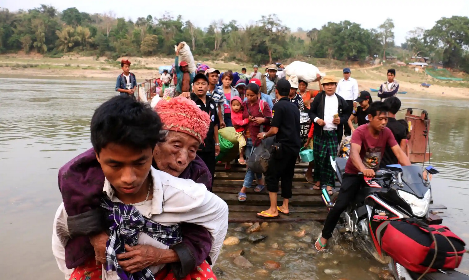 Some Kachin people (different from Chins) fleeing to safety. Img from The Guardian.