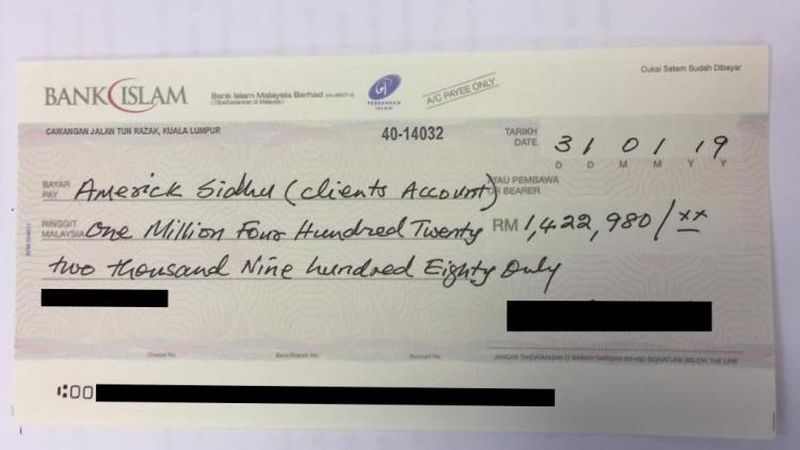 The RM1.4mil cheque. Image from MalayMail.