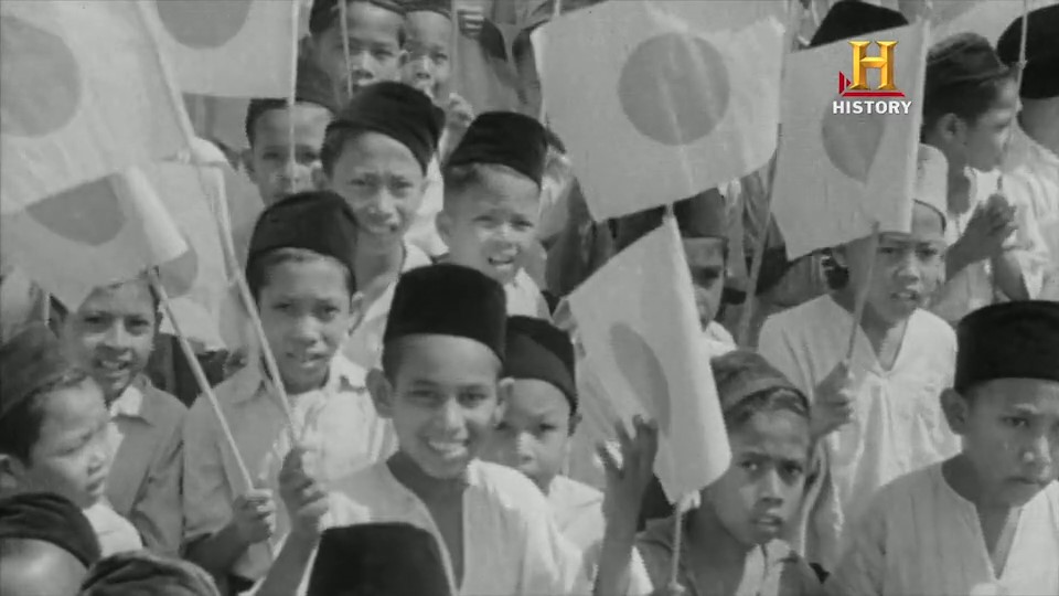 Malay kids with Japanese flags during the occupation. Screenshot from Road to Nationhood