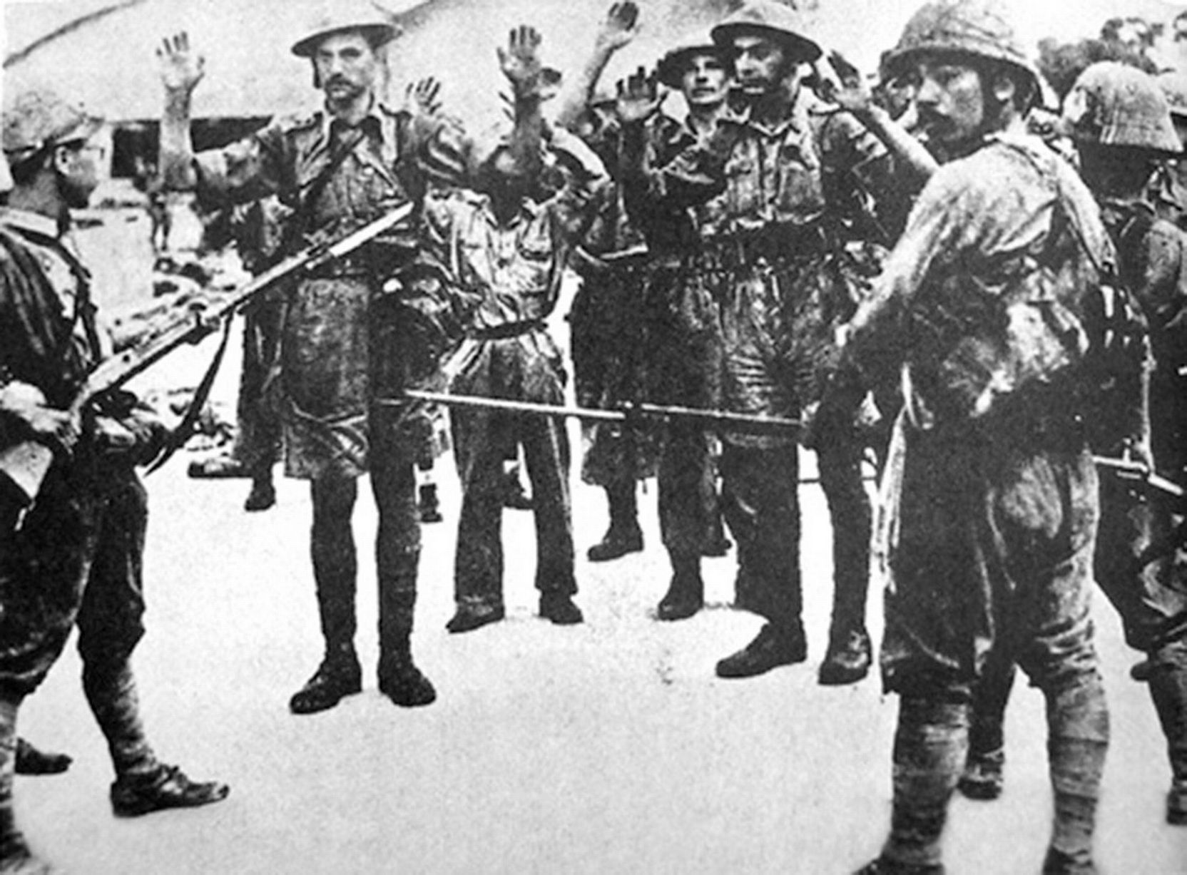 British troops that surrendered being held at gunpoint. Image from Pinterest 