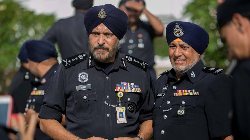 Datuk Seri Amar Singh (left), who retired from PDRM after 35 years of service. Image from: The Star Online