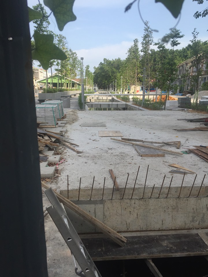 Street view of the koi fish stream under construction, with the Siaboey Market to the far right of the image.