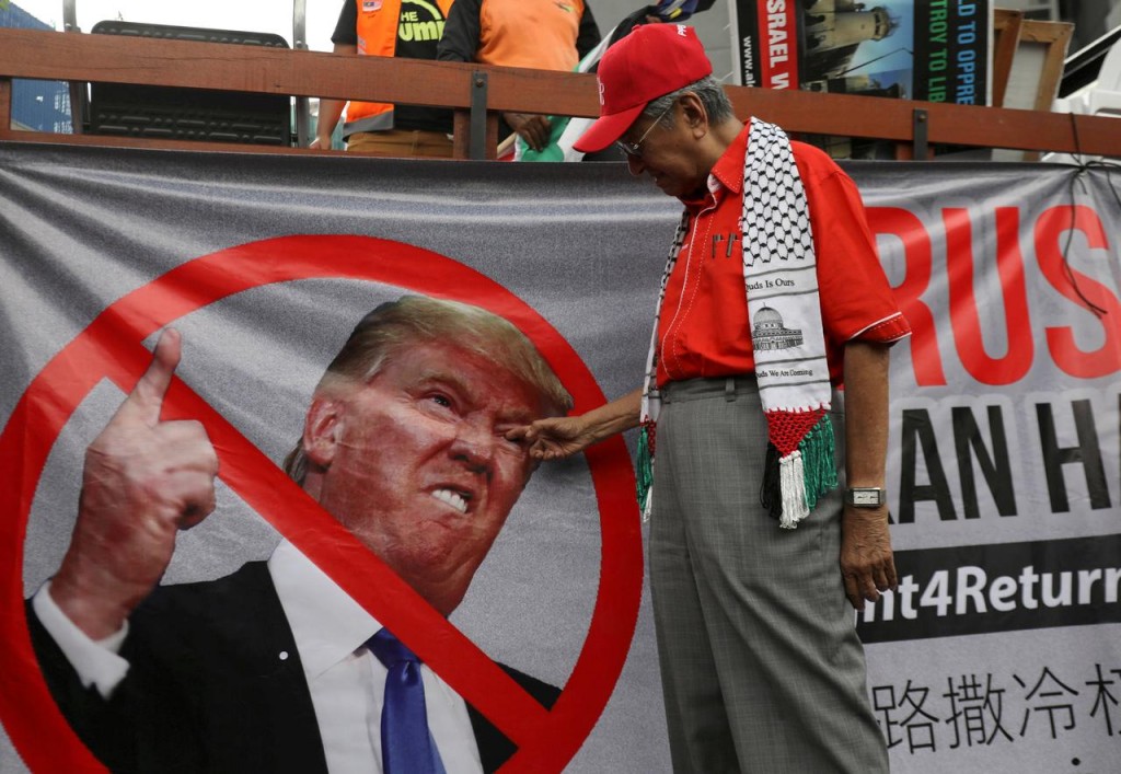 Tun-Senpai failed to notice The Donald. Image from: Reuters