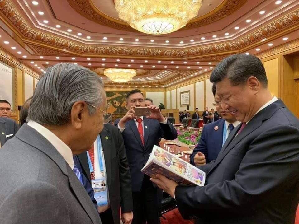 Alleged images of Xi Jinping getting his own personal copy.