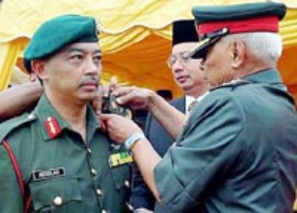 Agong being conferred as Brigadier General in 2004. Image from The Star