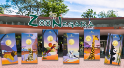 How did Zoo Negara manage to create its own animal-themed gold coins?