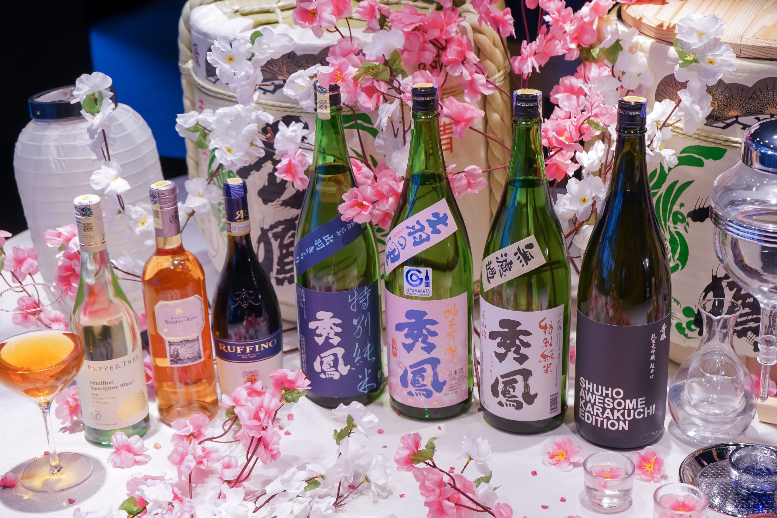 A collection of wine and sake bottles.
