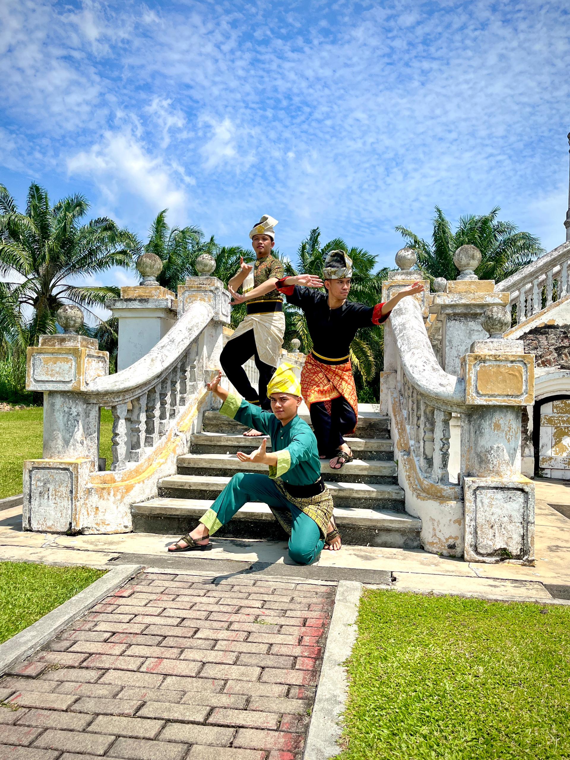 Malay Traditional wear with Tanjak headdress posing at Istana Bandar Selangor